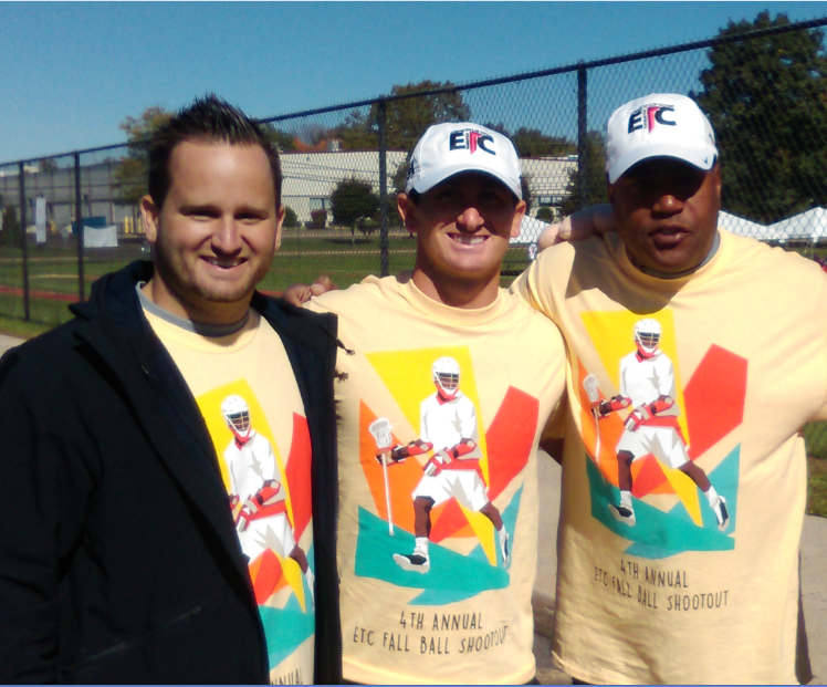 Three men wearing yellow t-shirt and two men wearing hat